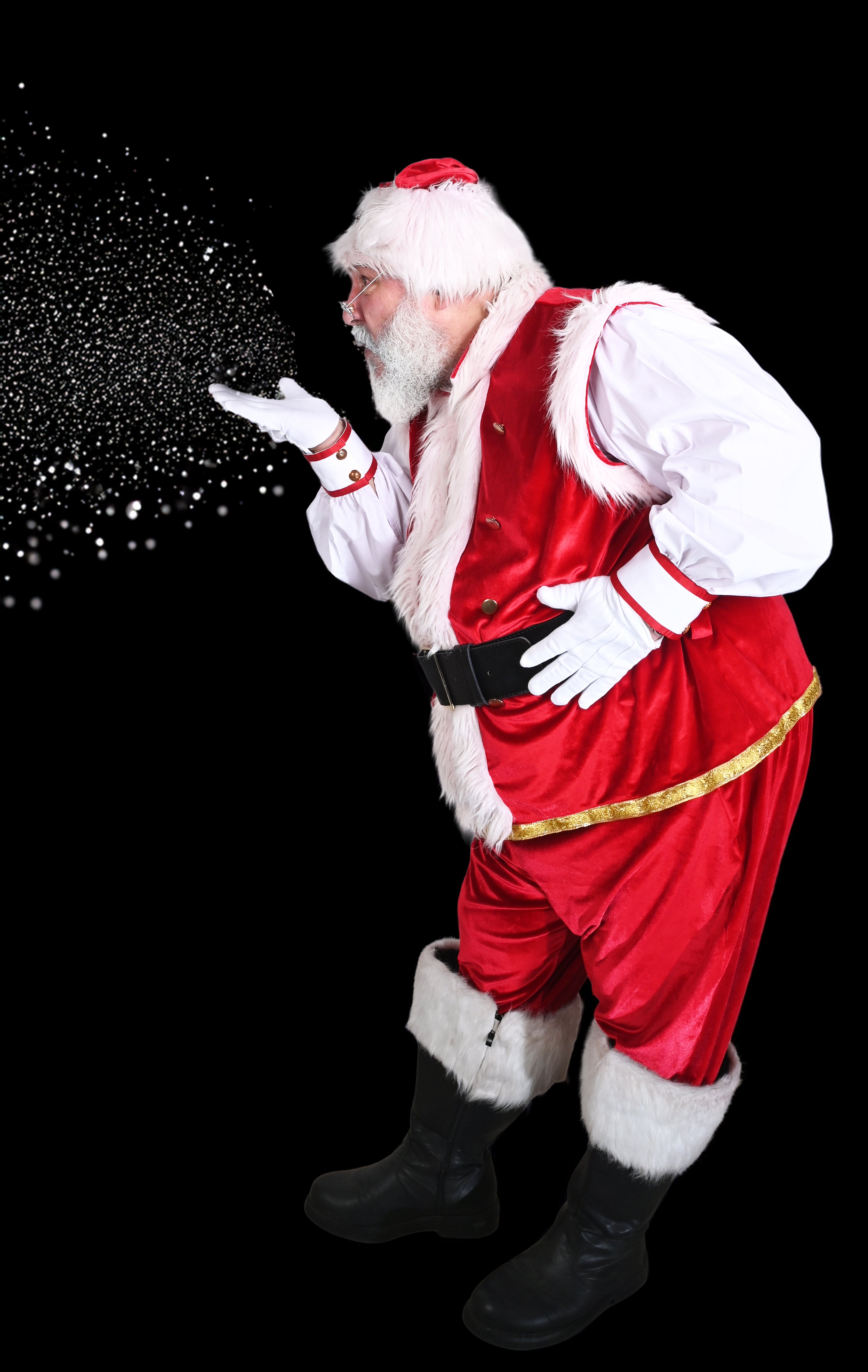 Santa Claus in a red suit with white fur trim against a black background with Charlie Warlie products